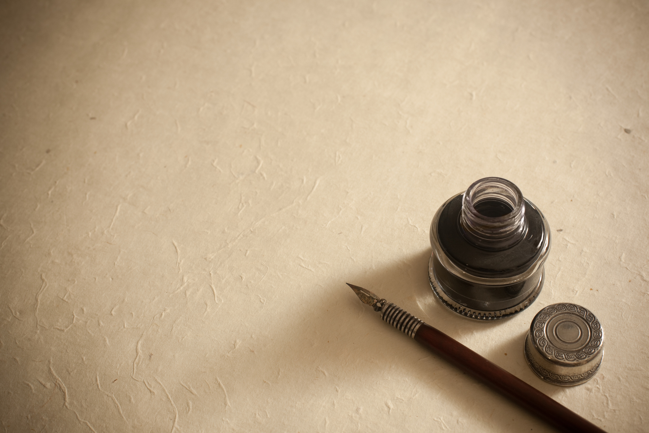 Old fountain pen and inkwell